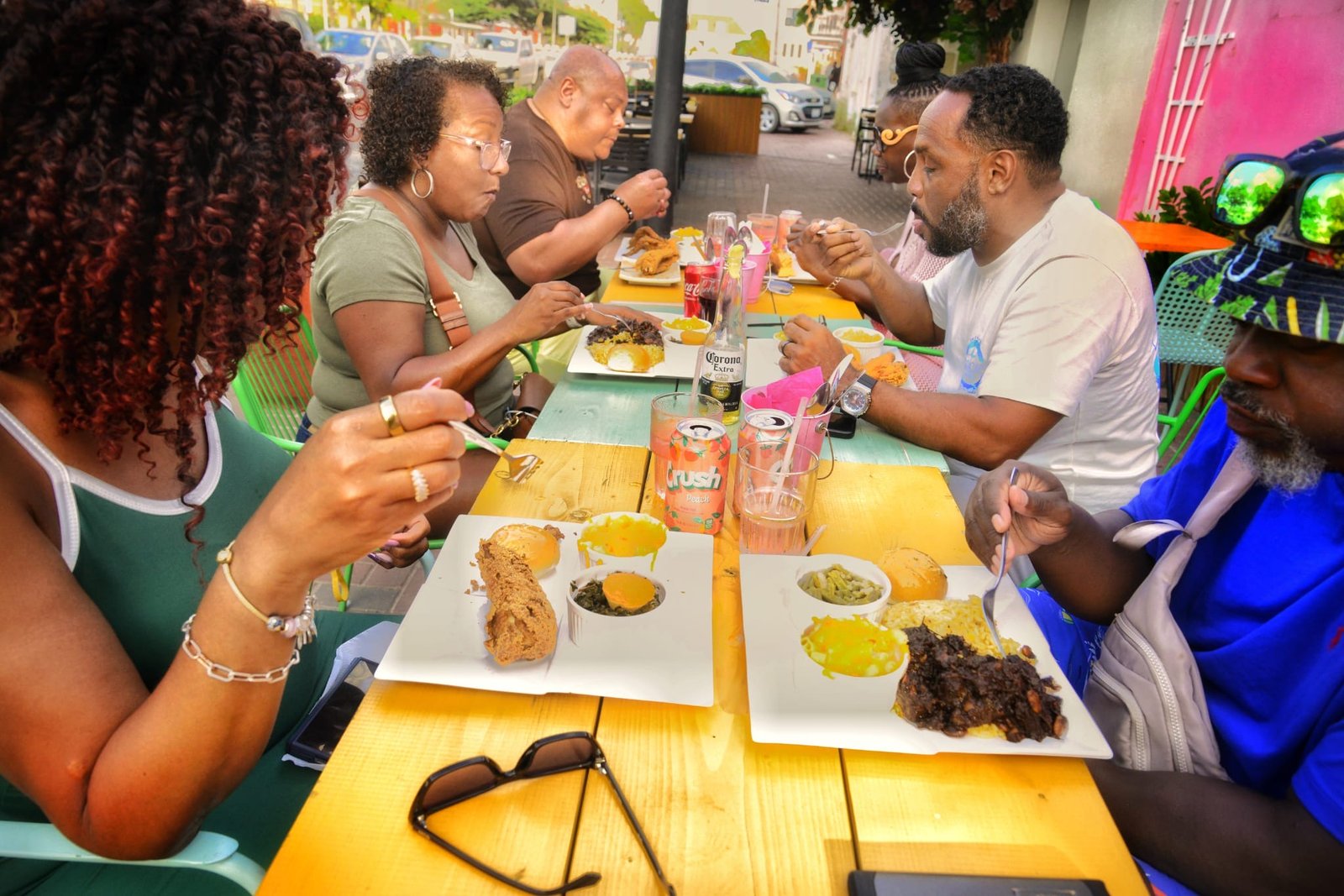 Friends sharing soul food at The Pink Unicorn